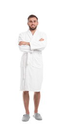 Handsome man wearing bathrobe on white background