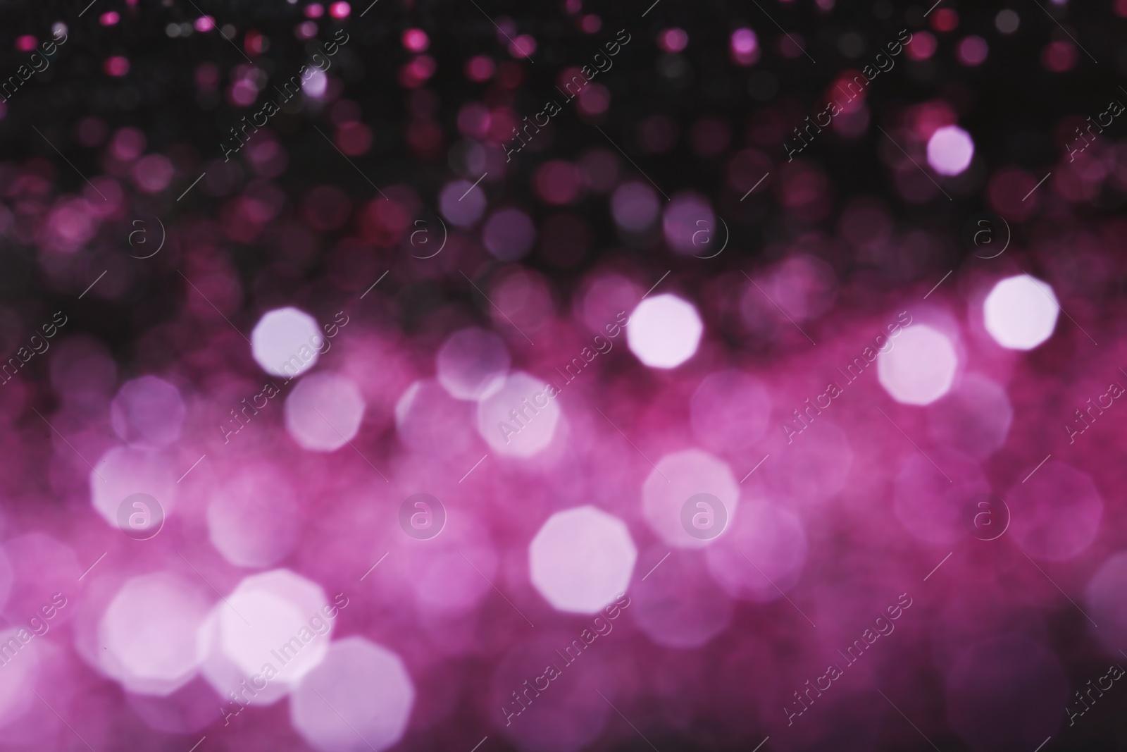 Photo of Magic pink bokeh effect on dark background