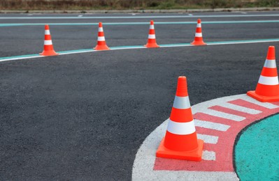 Photo of Driving school test track with marking lines and traffic cones