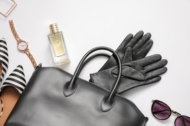 Photo of Flat lay composition with stylish black leather gloves, shoes and accessories on white background