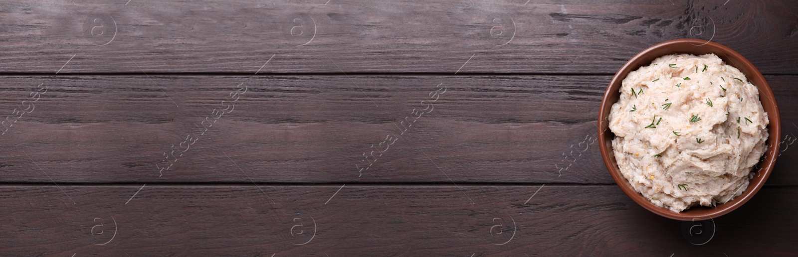 Photo of Delicious lard spread on wooden table, top view. Space for text