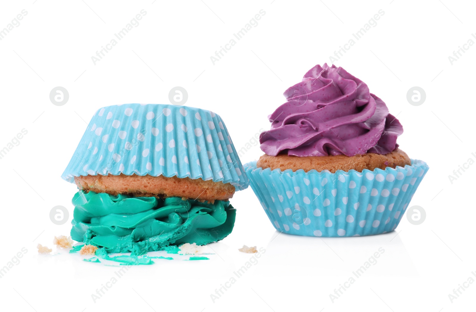 Photo of Dropped and good cupcakes on white background. Troubles happen