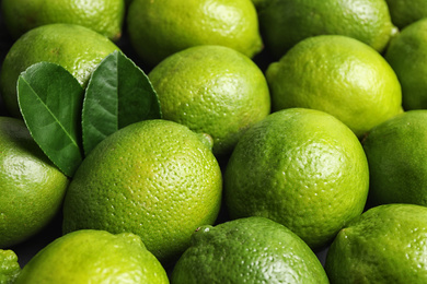 Photo of Fresh ripe juicy limes as background, closeup