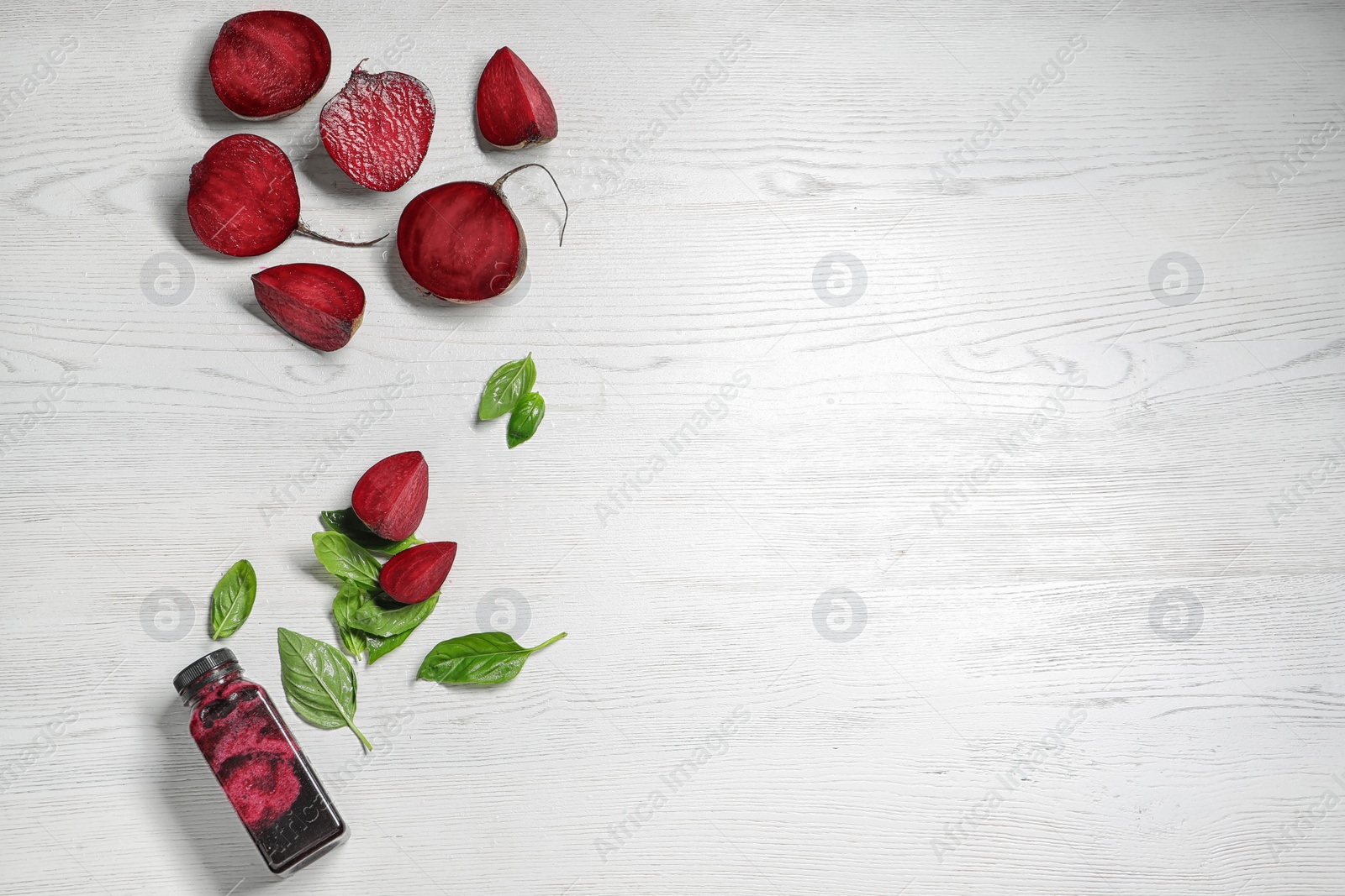 Photo of Flat lay composition with beet smoothie on white wooden background with space for text