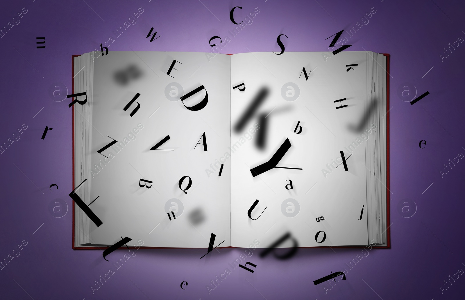 Image of Letters flying out of open book on purple background, top view