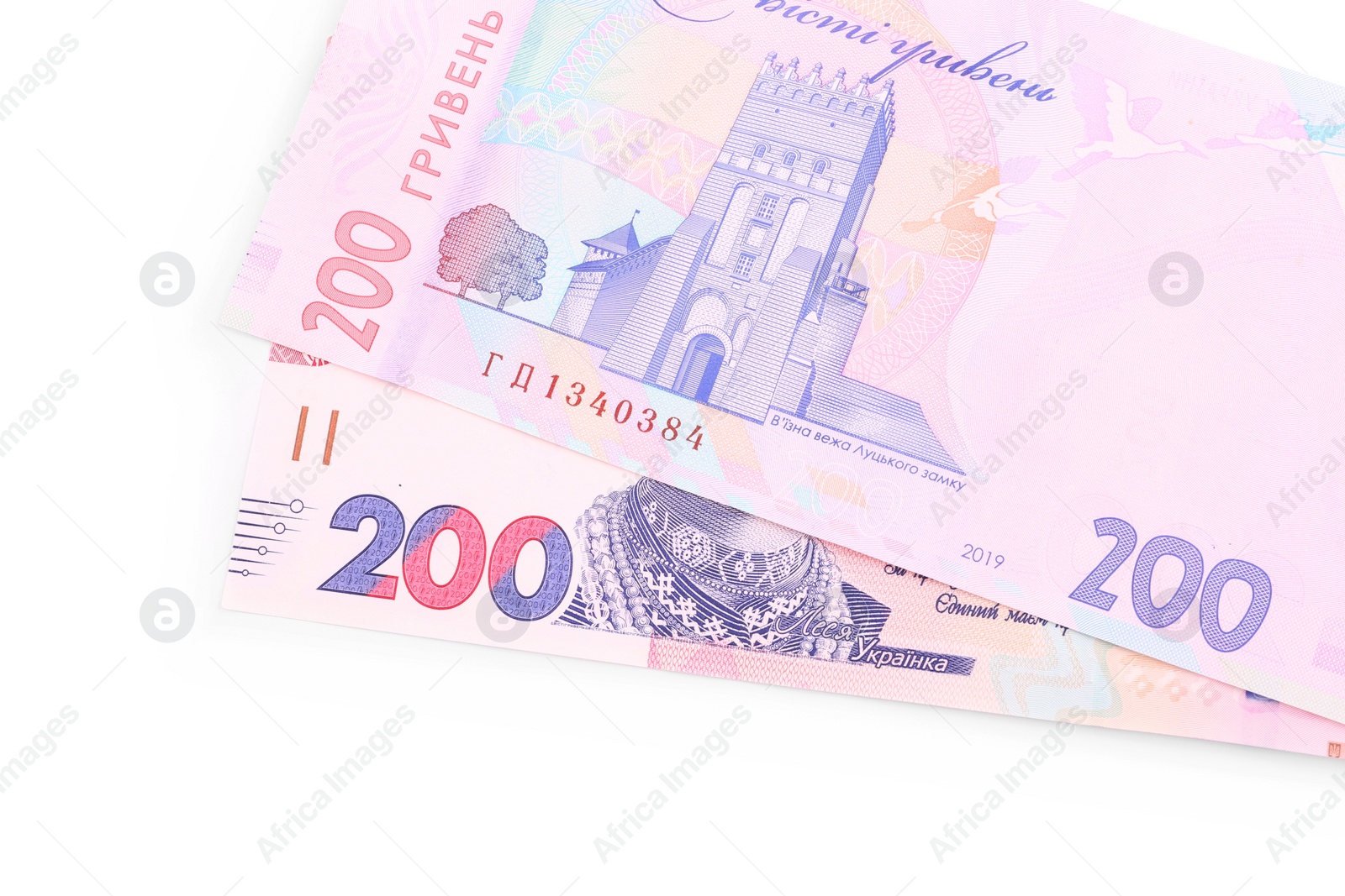 Photo of 200 Ukrainian Hryvnia banknotes on white background, top view