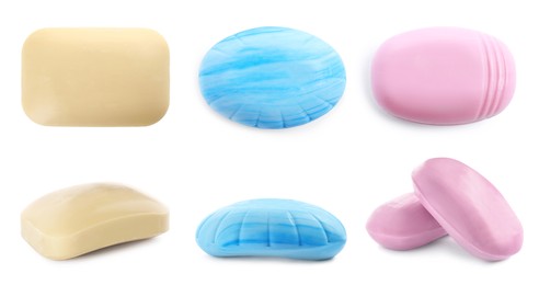Set with different soap bars on white background