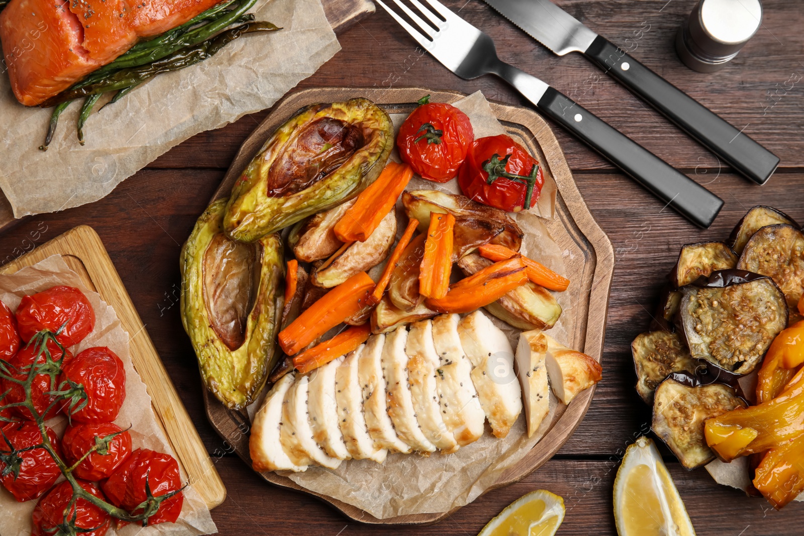 Photo of Tasty cooked chicken fillet and vegetables served on wooden table, flat lay. Healthy meals from air fryer