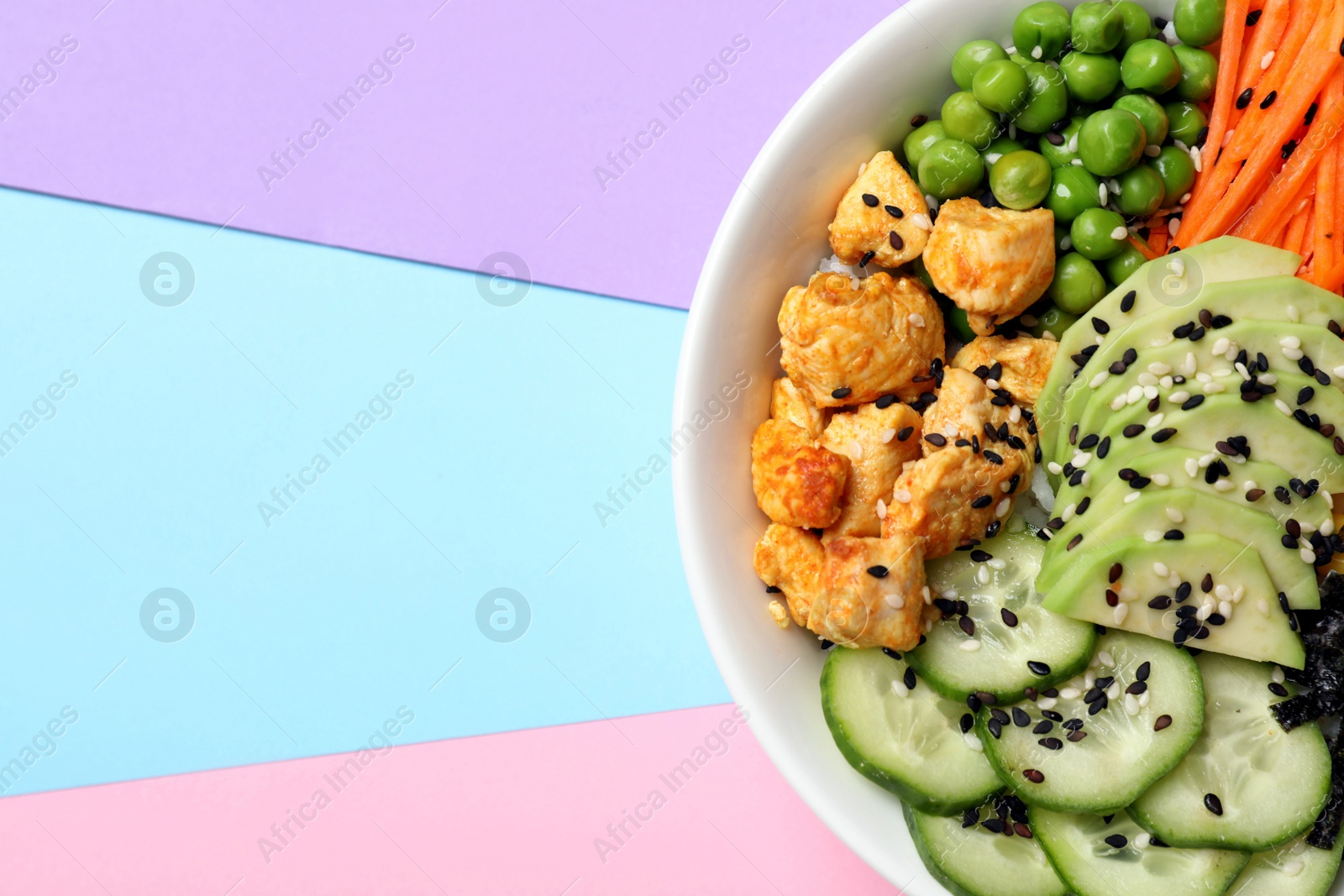 Photo of Delicious salad with chicken and vegetables on color background, top view. Space for text