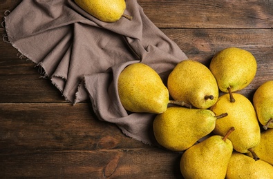 Photo of Flat lay composition with fresh ripe pears on wooden background