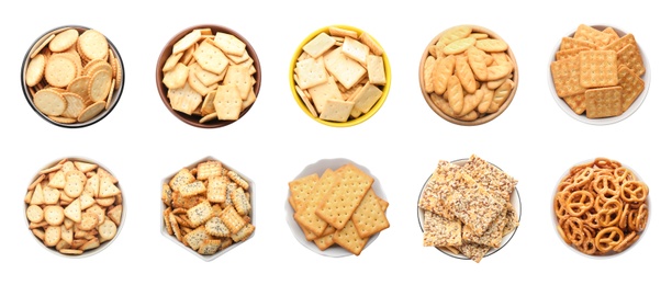 Image of Set of different tasty crackers in bowls on white background, top view