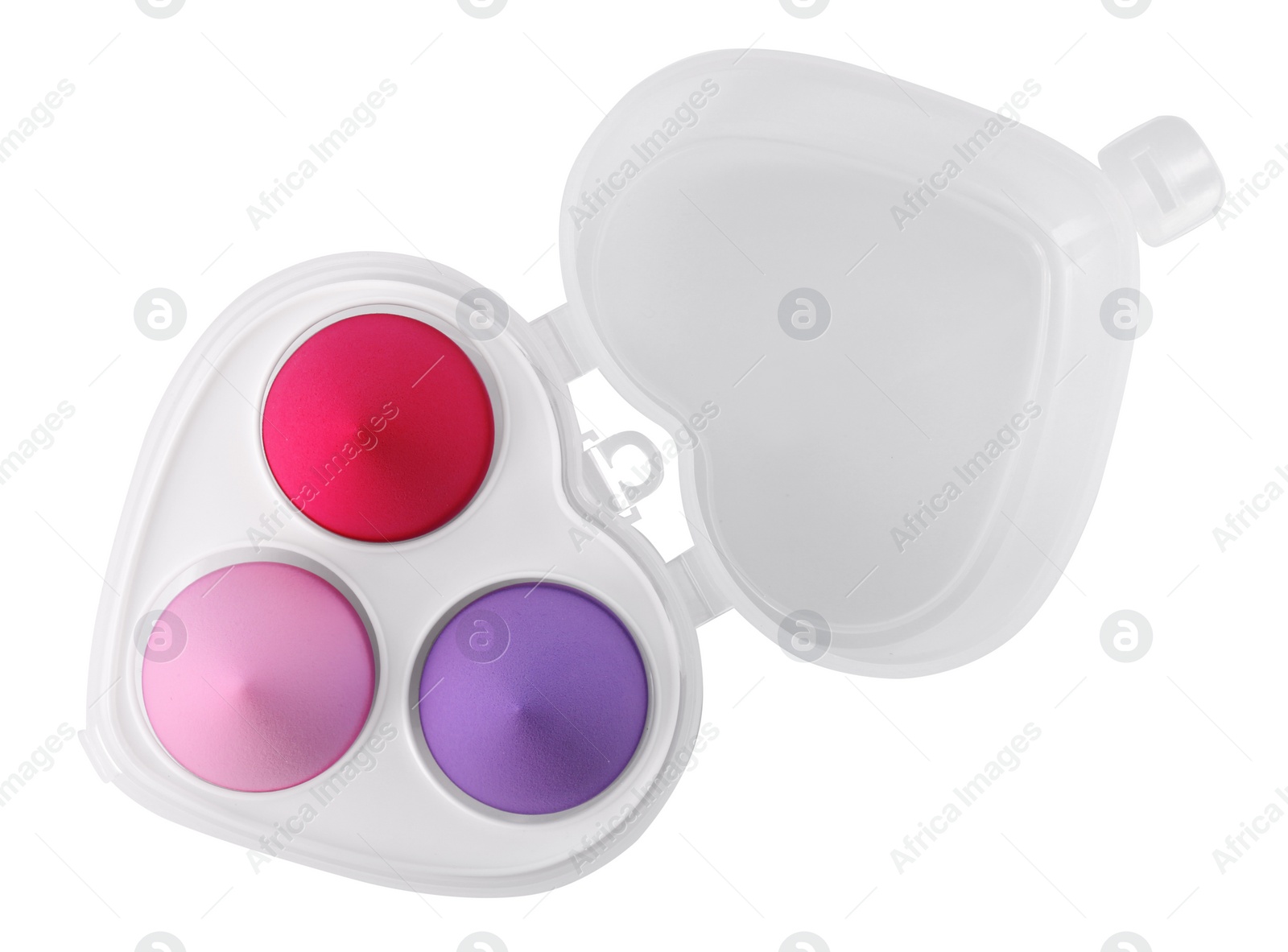 Photo of Heart shaped organizer with makeup sponges isolated on white, top view