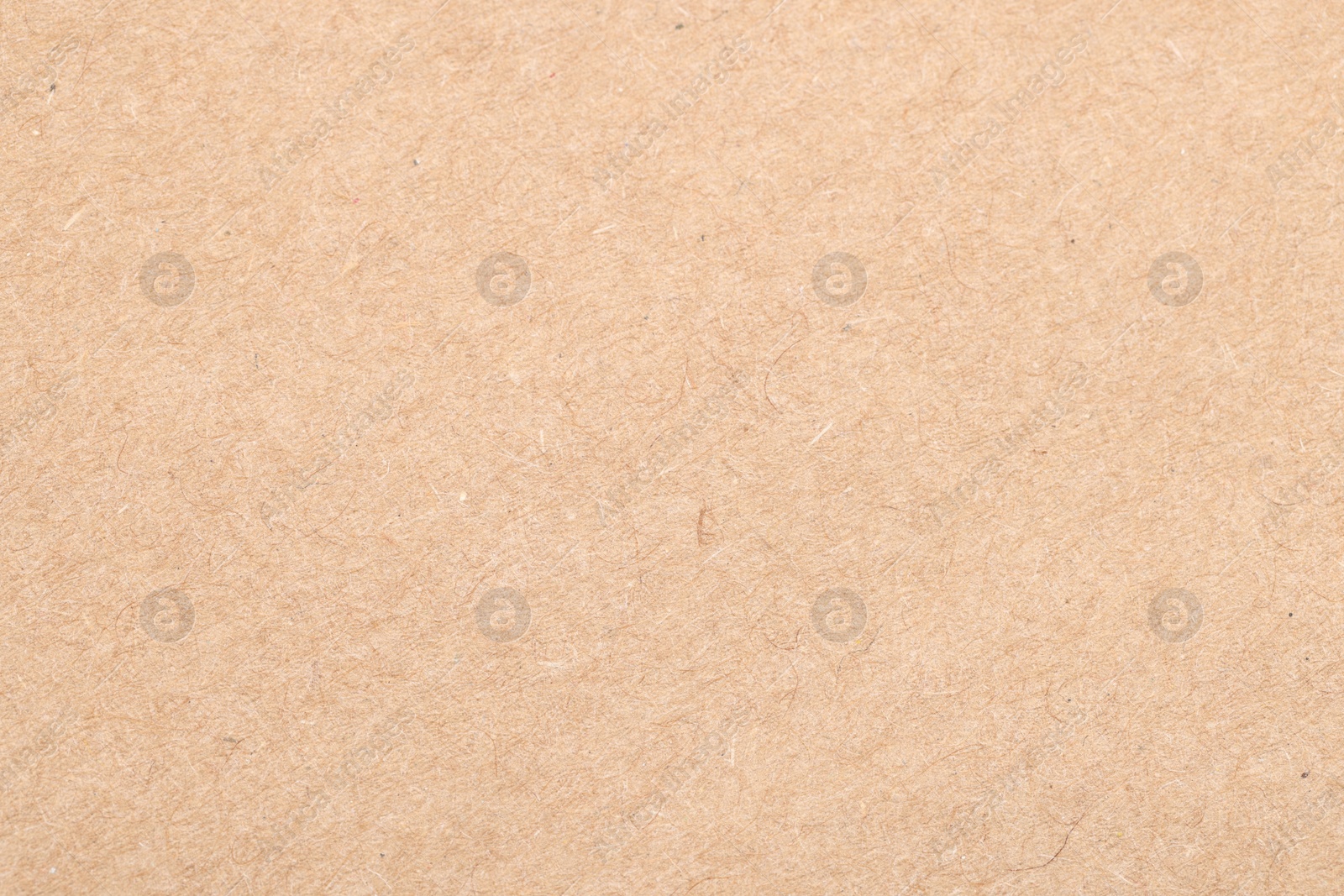 Photo of Texture of beige paper sheet as background, top view