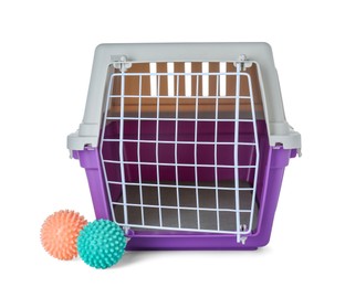 Violet pet carrier and toys isolated on white