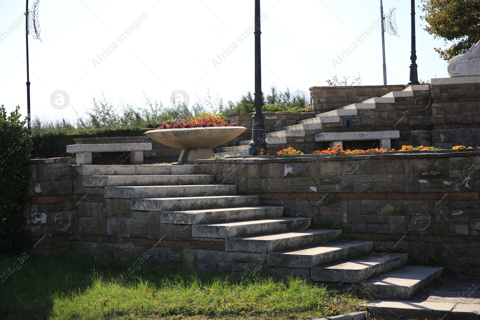 Photo of View of empty old concrete staircase outdoors on sunny day