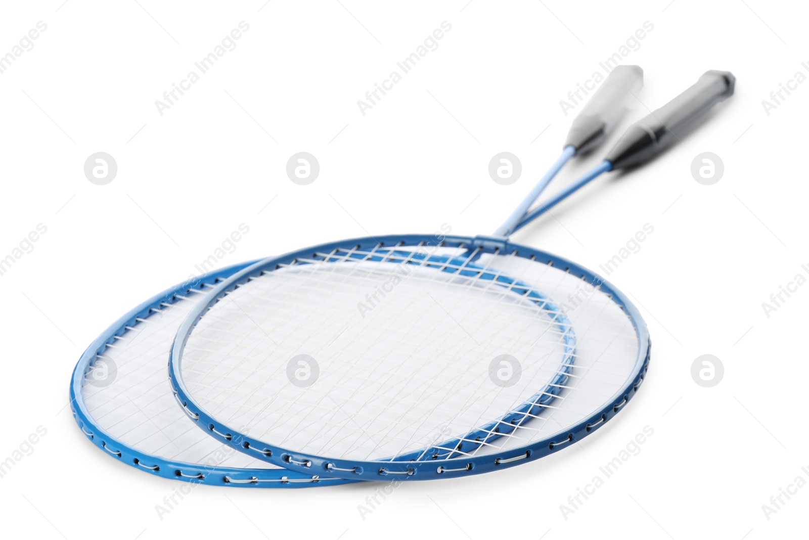 Photo of Badminton rackets on white background. Sport equipment