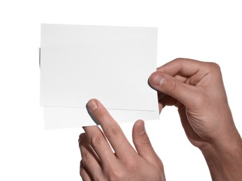 Photo of Man holding paper cards on white background, closeup. Mockup for design