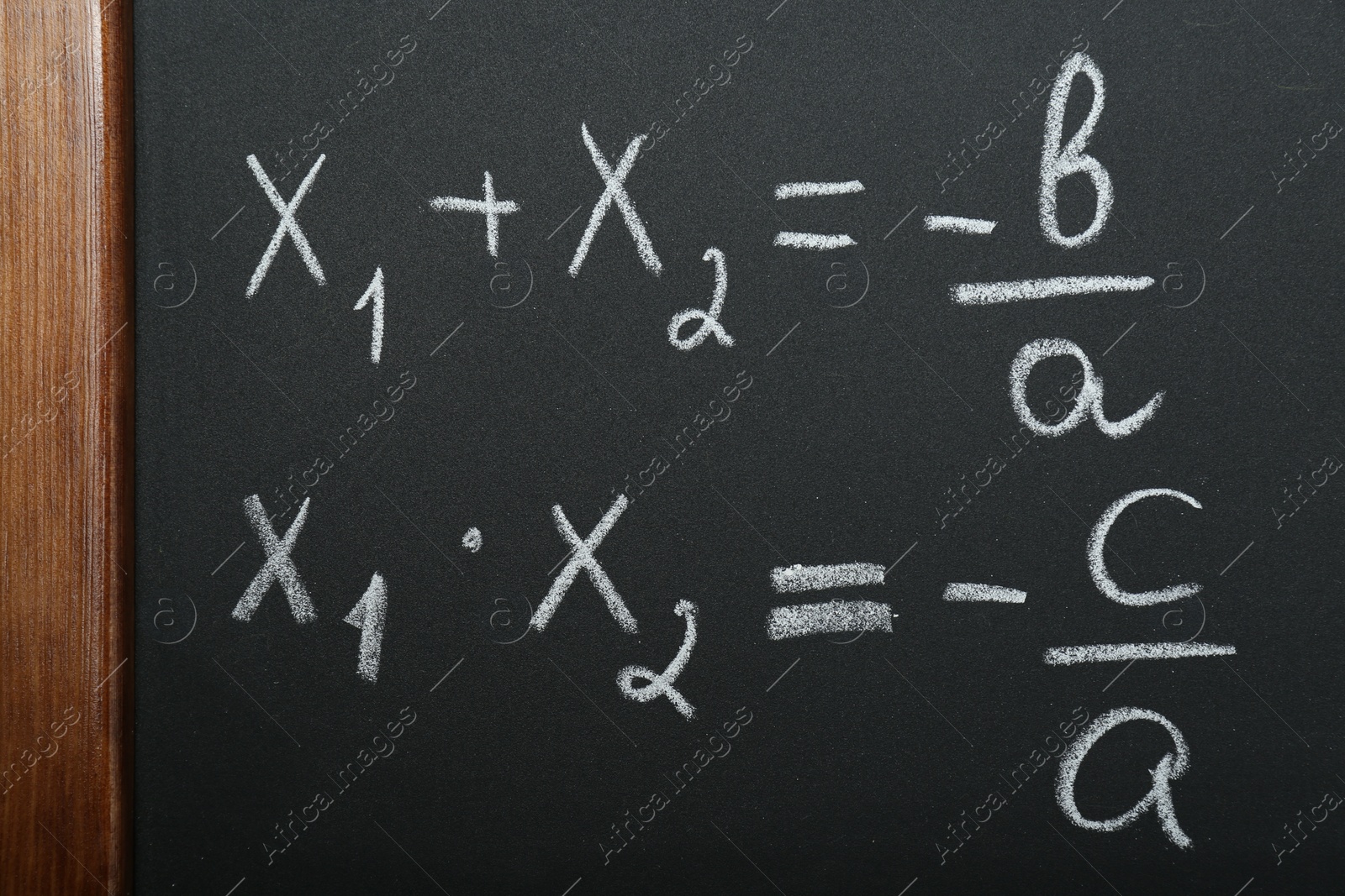 Photo of Many different math formulas written on chalkboard, closeup