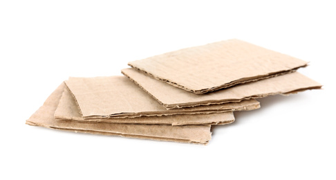 Photo of Pieces of brown cardboard isolated on white