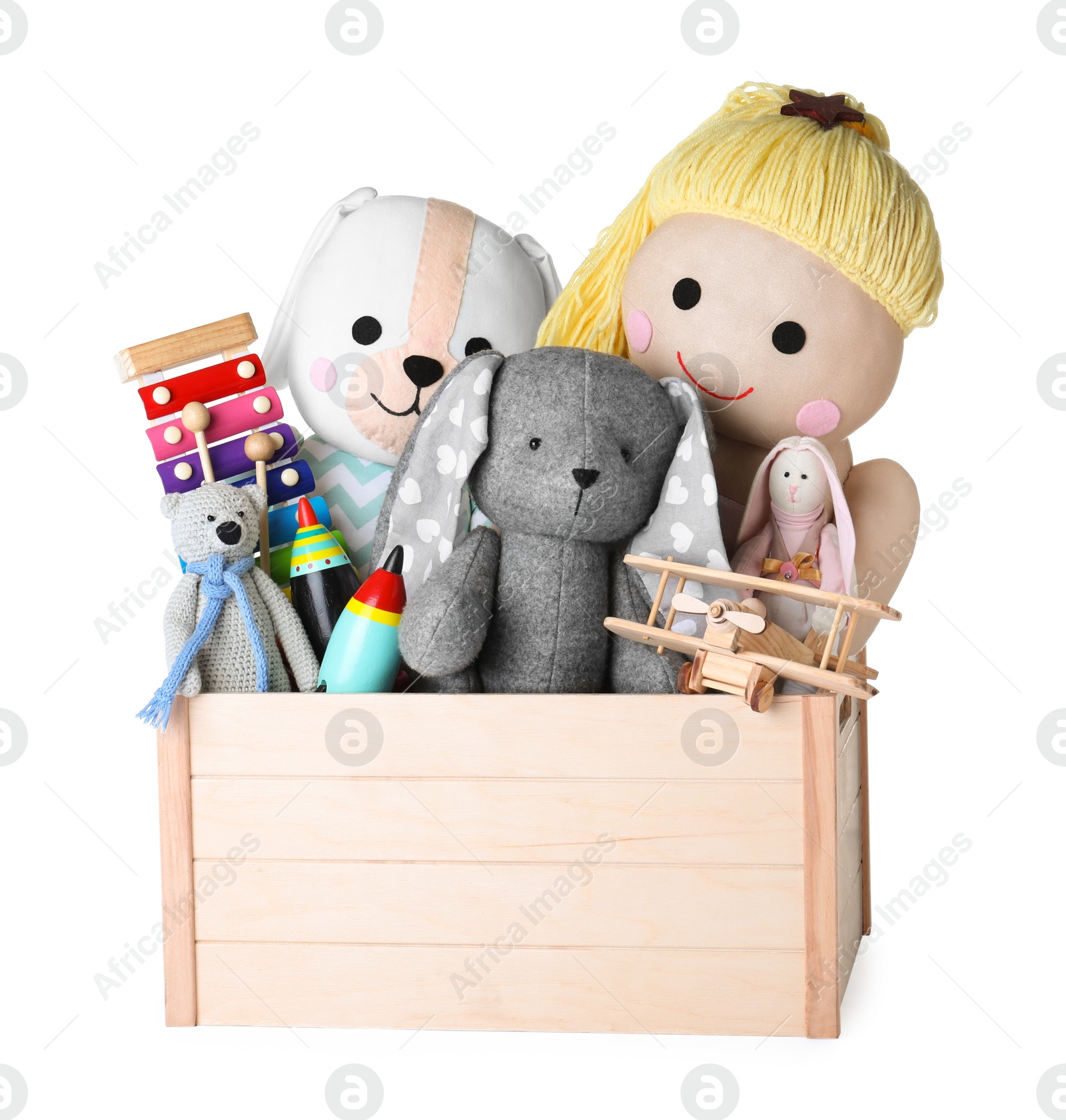 Photo of Wooden crate with different toys isolated on white