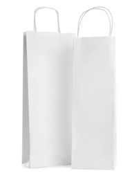 Photo of Blank paper bags on white background. Mockup for design