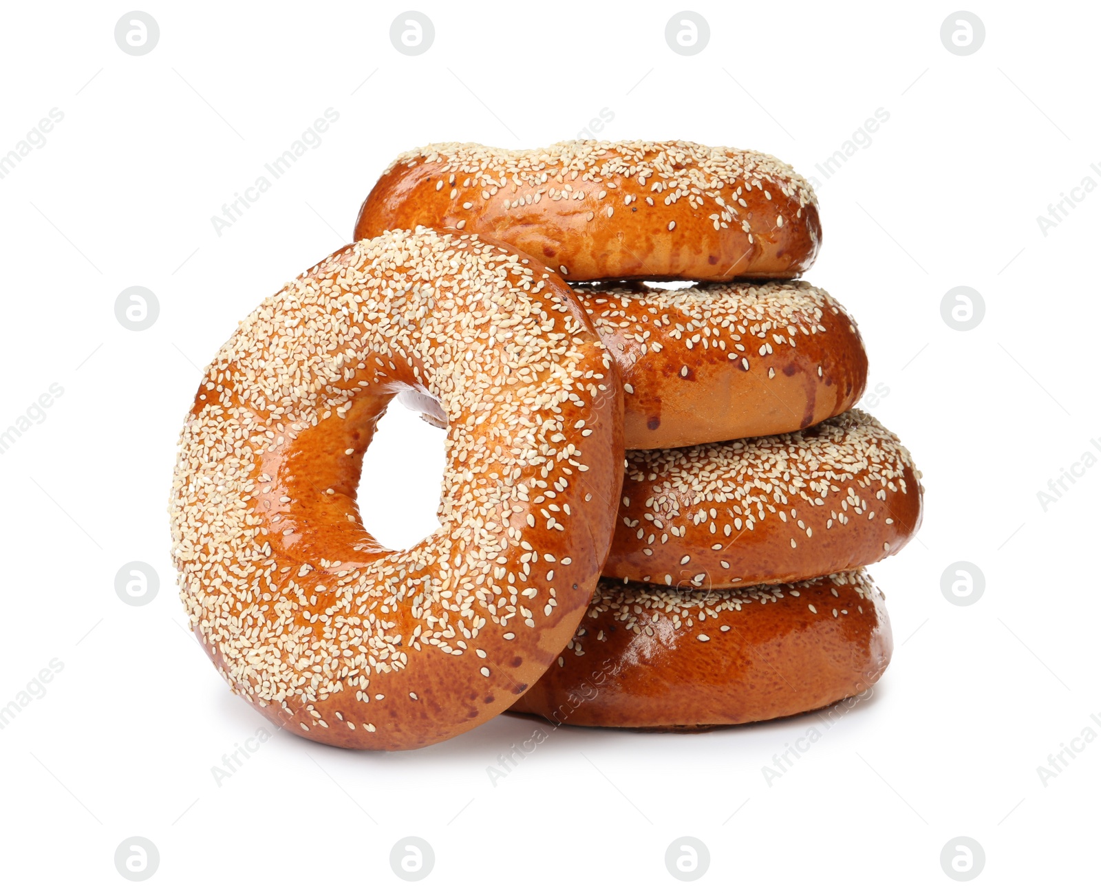 Photo of Many delicious fresh bagels on white background