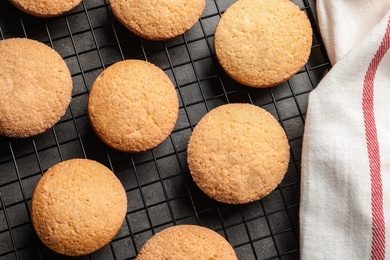 Photo of Baking grid with Danish butter cookies on grey background, top view