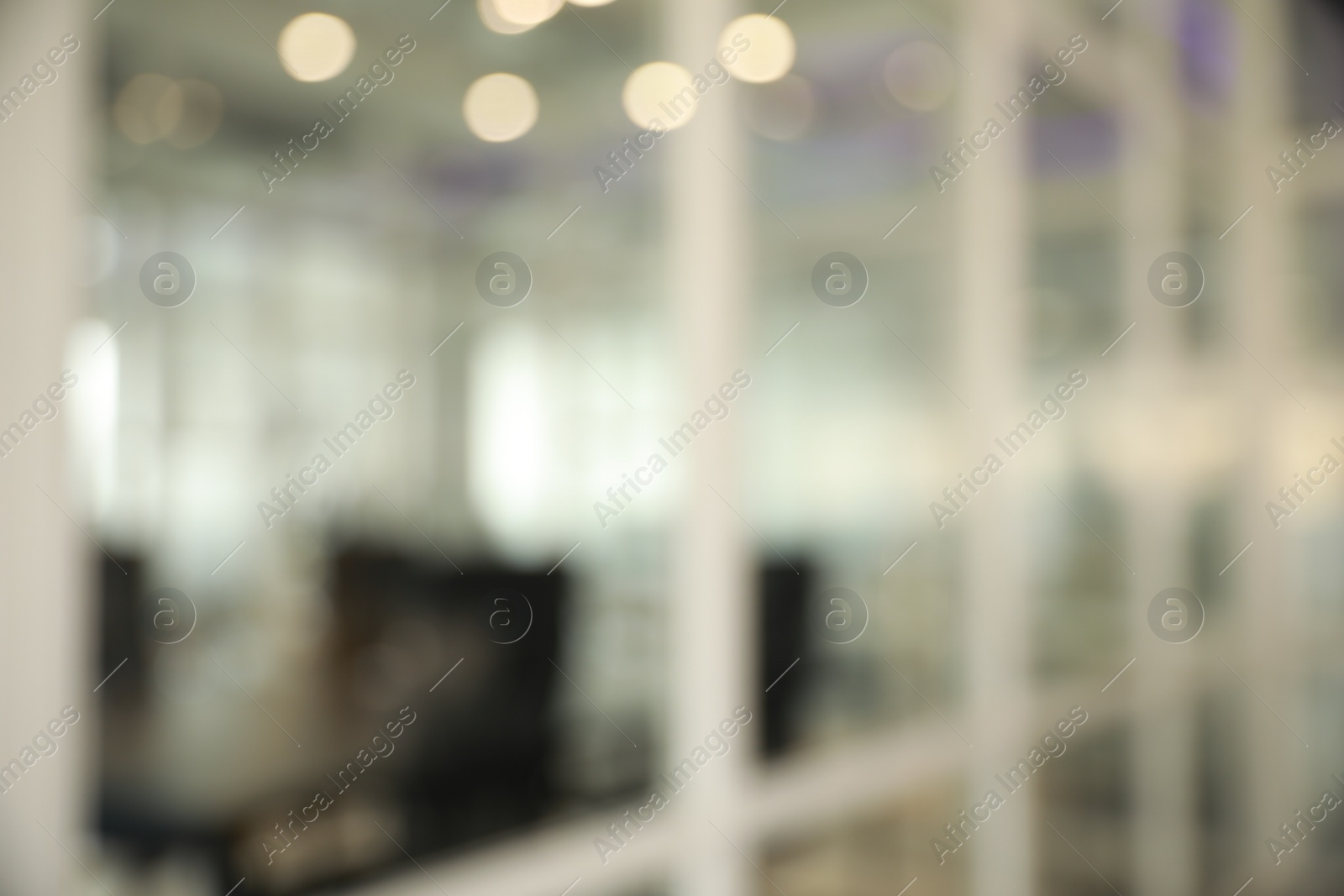 Photo of Blurred view of cozy workspaces with tables and chairs in office