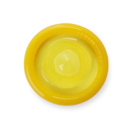 Photo of Unpacked yellow condom isolated on white, top view. Safe sex