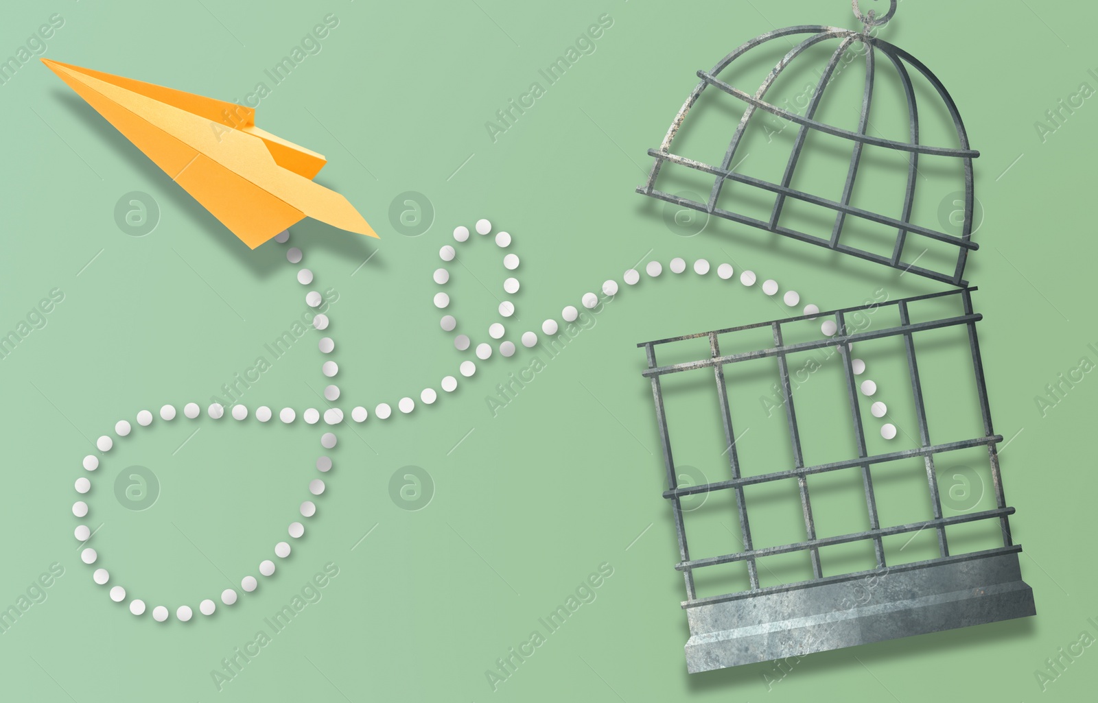 Image of Freedom. Paper plane flying out of open cage on olive color background