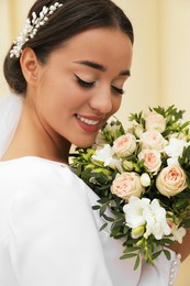 Photo of Young bride with beautiful wedding bouquet outdoors