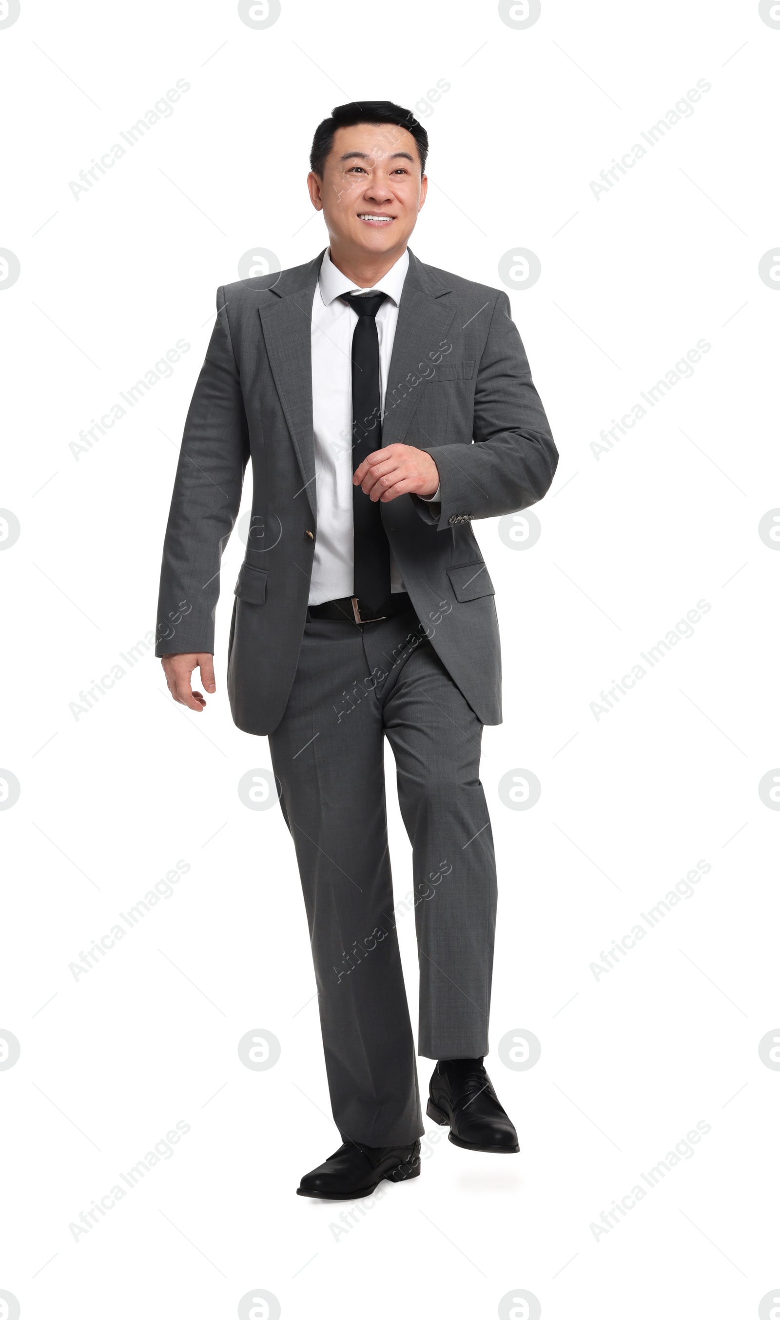 Photo of Businessman in suit walking on white background