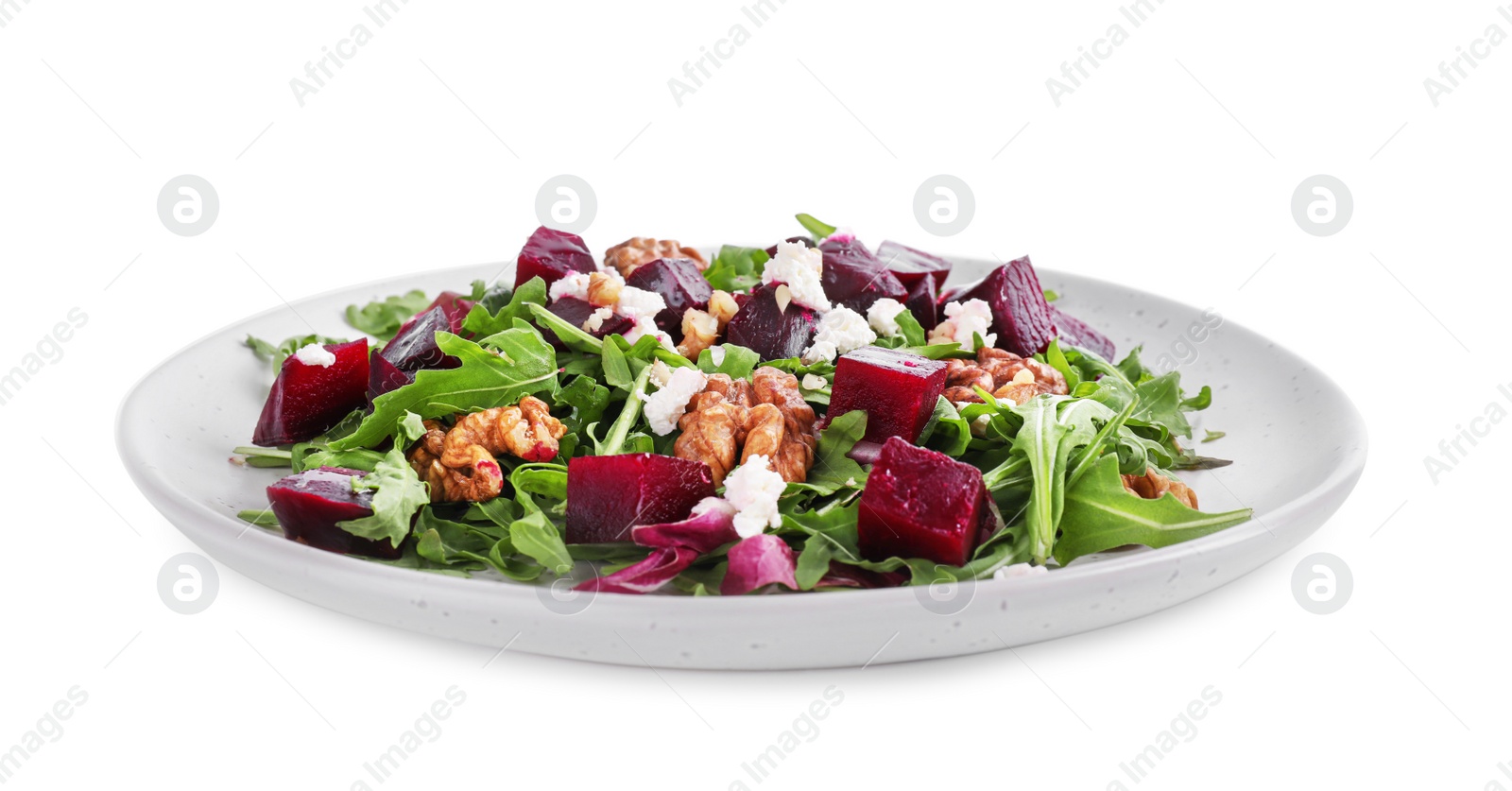 Photo of Delicious beet salad with arugula and walnuts isolated on white