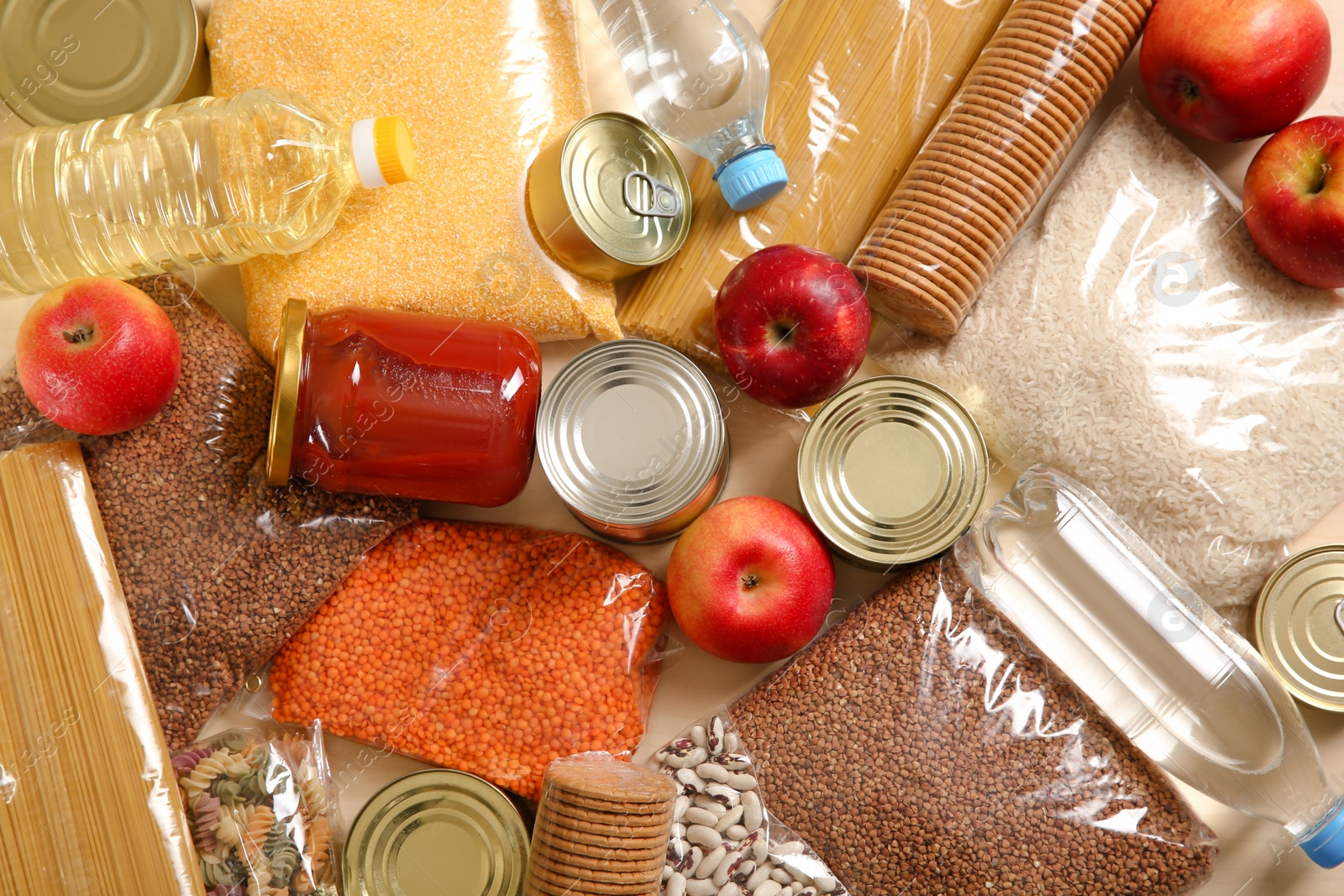 Photo of Many different products on table, top view. Food donation