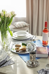 Photo of Table served for Passover (Pesach) Seder indoors