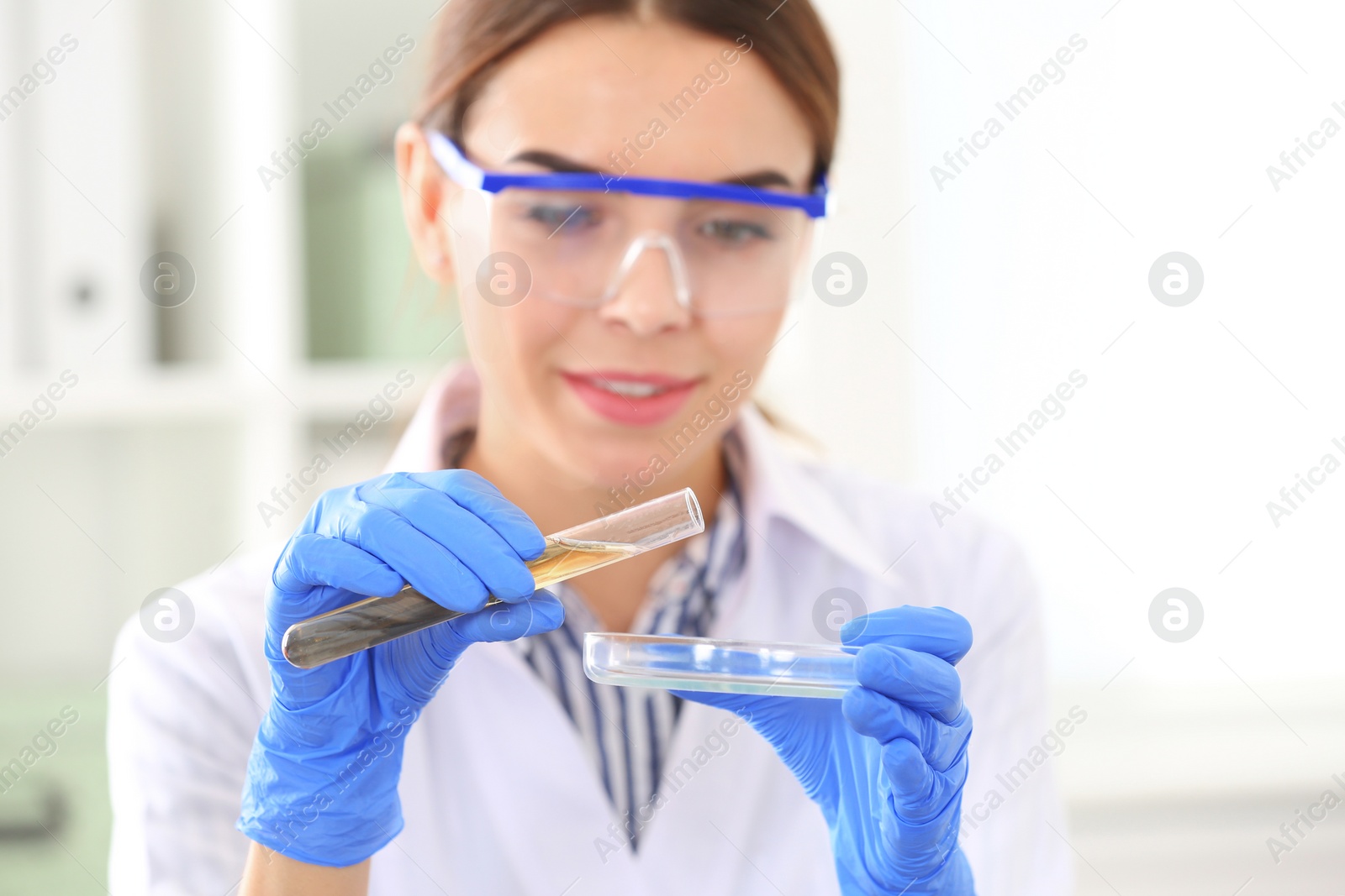 Photo of Female scientist working in laboratory. Research and analysis