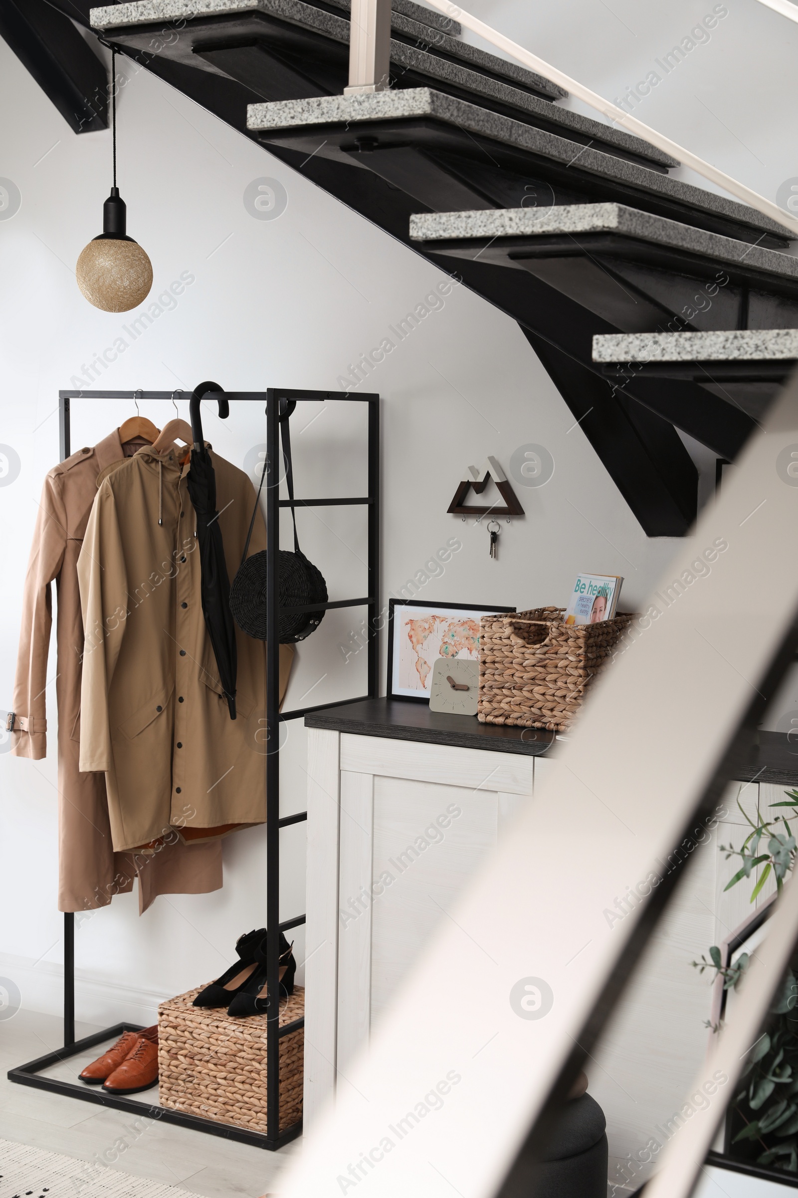 Photo of Modern hallway interior with stylish furniture and key holder