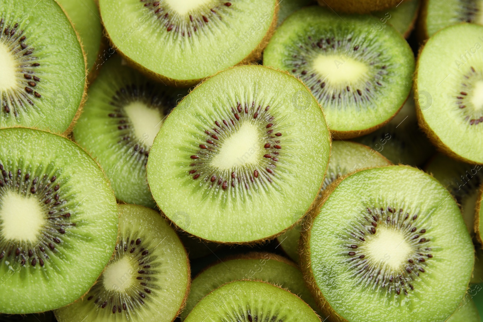 Photo of Halves of fresh kiwis as background, above view
