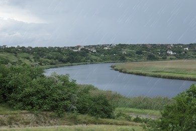 Beautiful view of river on grey day. Rainy weather