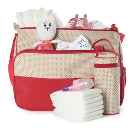 Photo of Mother's bag with baby's stuff isolated on white