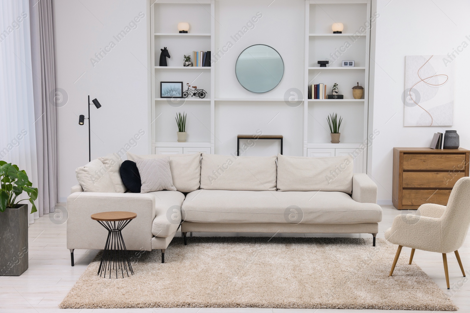 Photo of Beautiful carpet, furniture and accessories in living room