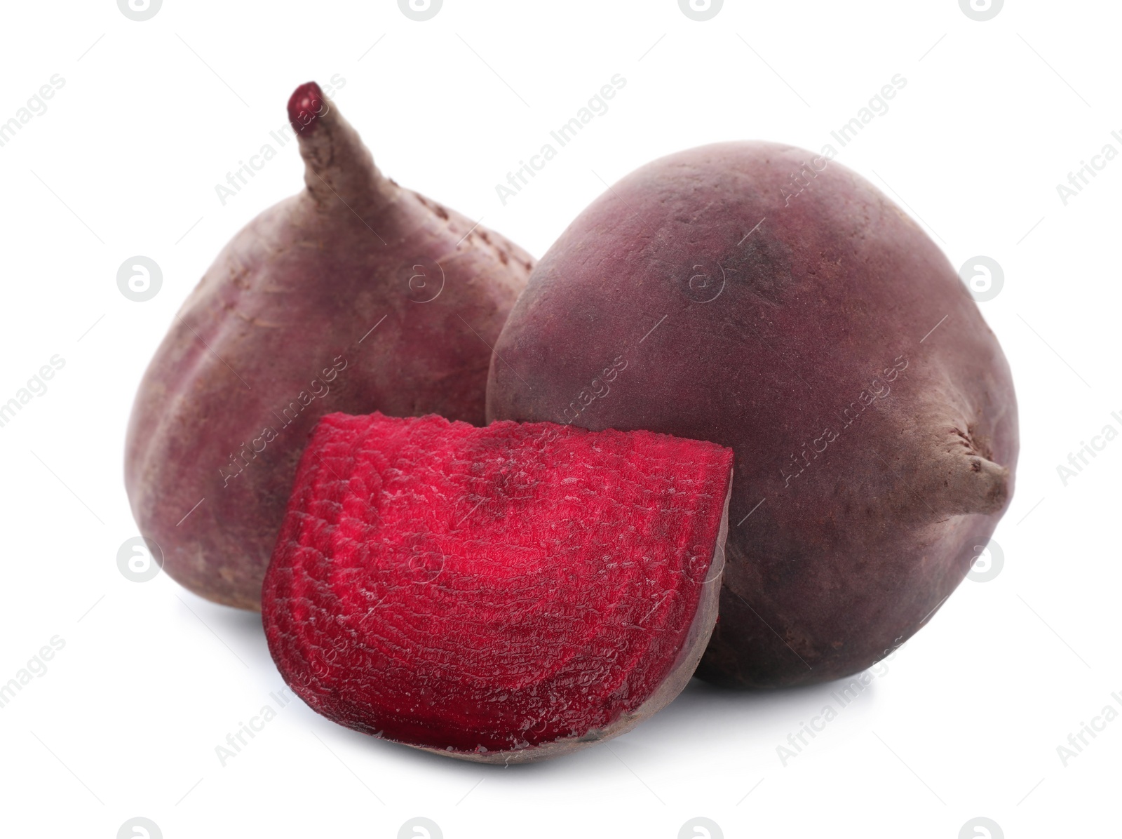 Photo of Cut and whole beets on white background. Taproot vegetable