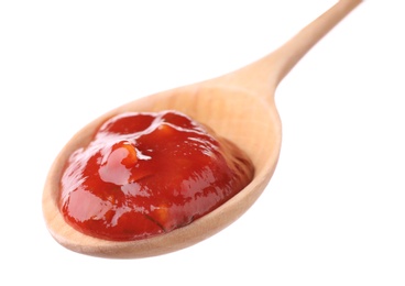 Wooden spoon with red sauce on white background