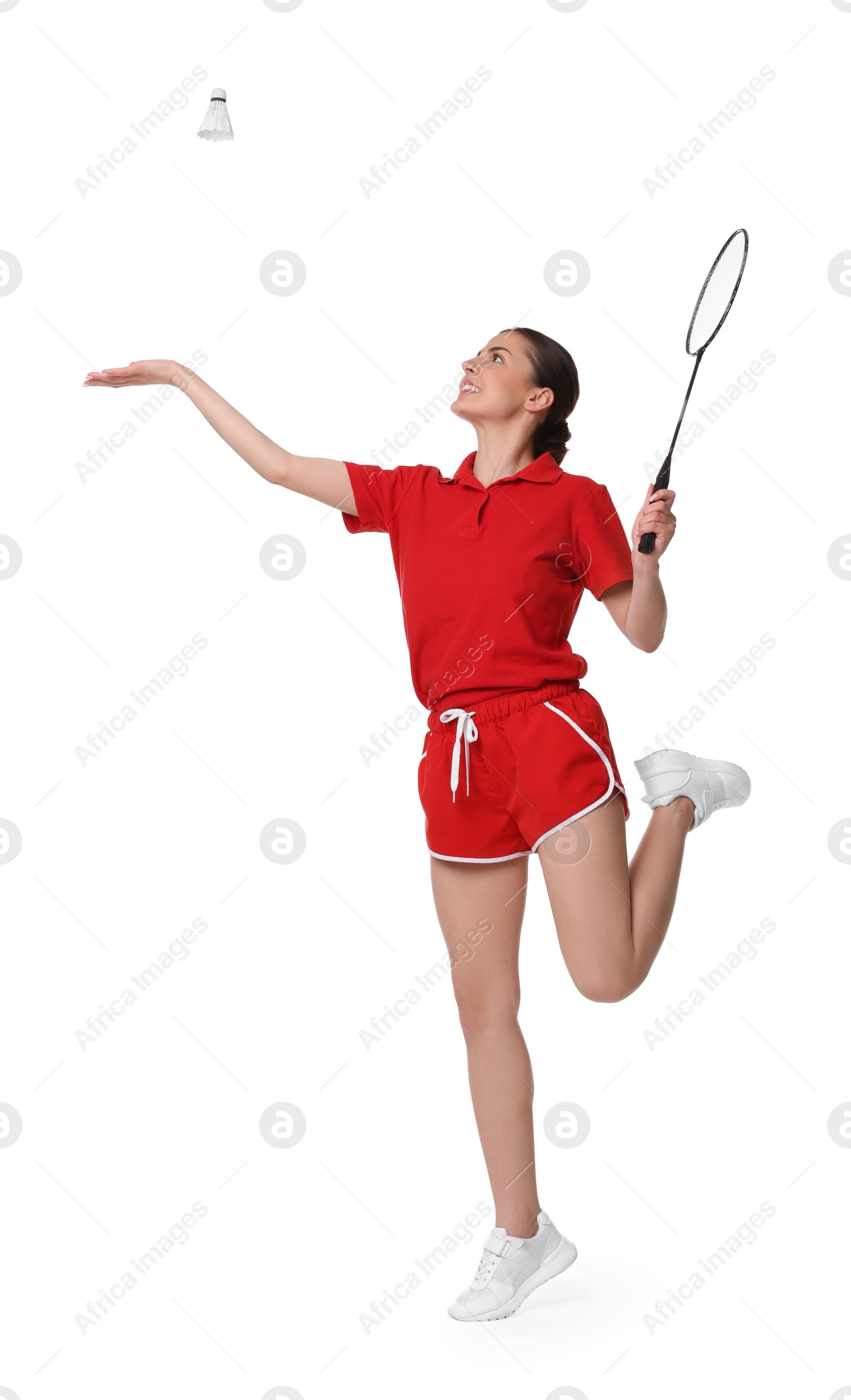 Photo of Young woman playing badminton with racket on white background