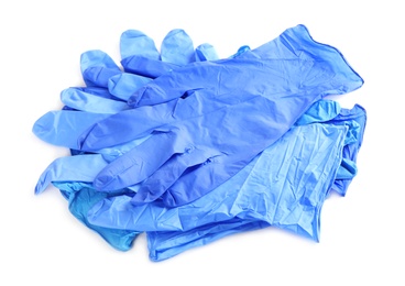 Photo of Heap of medical gloves isolated on white