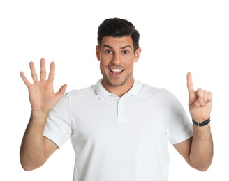 Photo of Man showing number six with his hands on white background