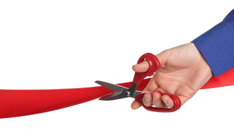 Photo of Man cutting red ribbon on white background, closeup