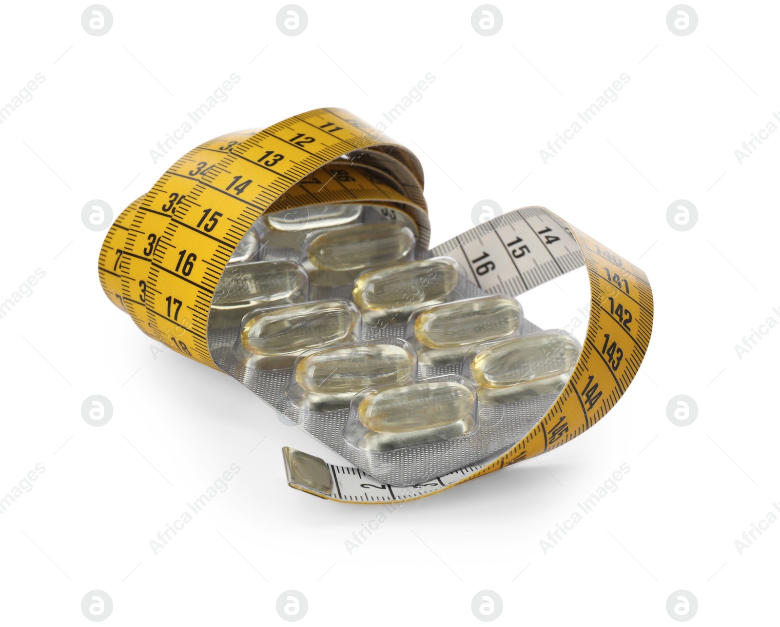 Photo of Oil capsules and measuring tape on white background. Weight loss