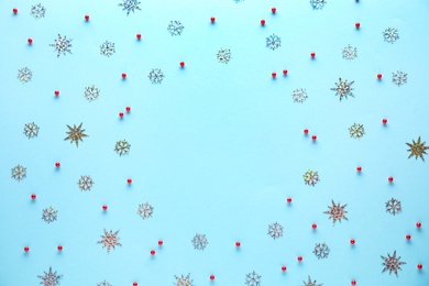 Photo of Flat lay composition with Christmas decorations on light blue background, space for text