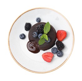 Photo of Plate with delicious chocolate fondant, berries and mint isolated on white, top view